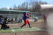 1990 Chevrolet Suburban - A batter attempts to hit a softball while a catcher waits behind home plate.