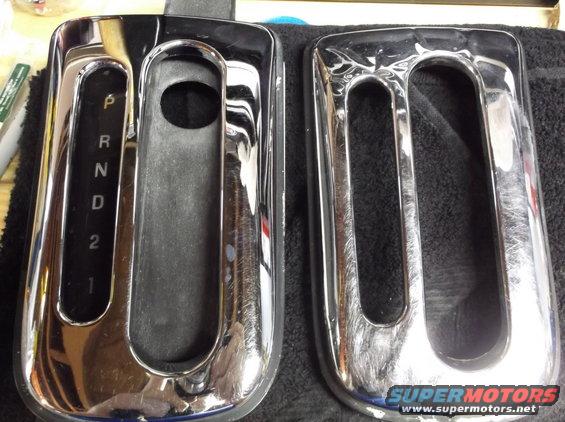 Two chrome gear shifter trim pieces, one with P, R, N, D, 2, 1 markings