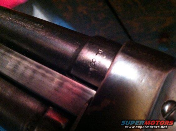 Close-up of firearm barrel with markings 'F 308'