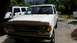 1990 Ford Bronco - White 1990 Ford Bronco parked in a driveway with another vehicle beside it.