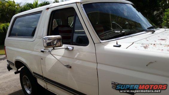 White 1990 Ford Bronco, driver's side, front 3/4 view, showing rust spots on hood and roof