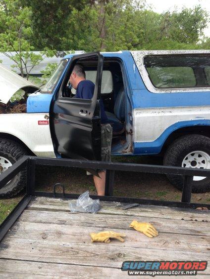 Blue and white 1979 Ford Bronco with open doors and hood