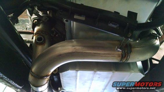 Custom exhaust pipe welded to a transmission pan