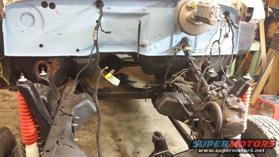 1978 Ford Bronco engine bay during restoration, showing brake booster and wiring