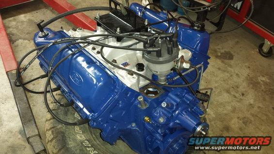 Blue Ford V8 engine with distributor and spark plug wires