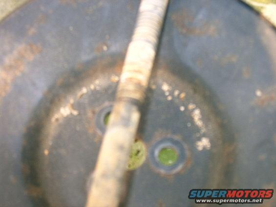 Smog pump with a ribbed hose passing over it