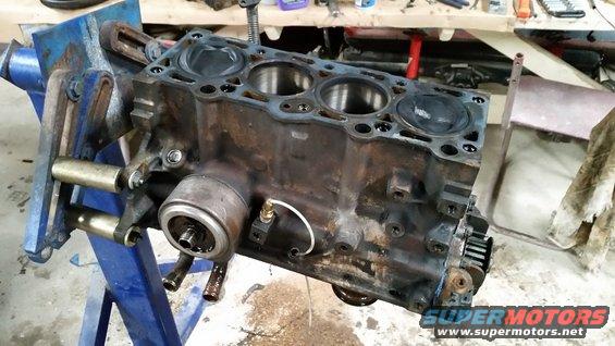 Engine block held in a blue vise