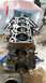 1985 Ford Escort - This engine block is disassembled and mounted on a stand for repair or inspection.
