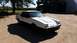 1985 Ford Escort - This 1985 Ford EXP Turbo coupe has a distinctive hood scoop and is parked outdoors.