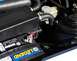 1985 Ford Escort - Engine bay detail showing a car battery and associated wiring and hoses.