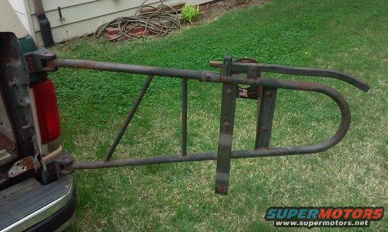 Truck tailgate with a metal carrier attached to it