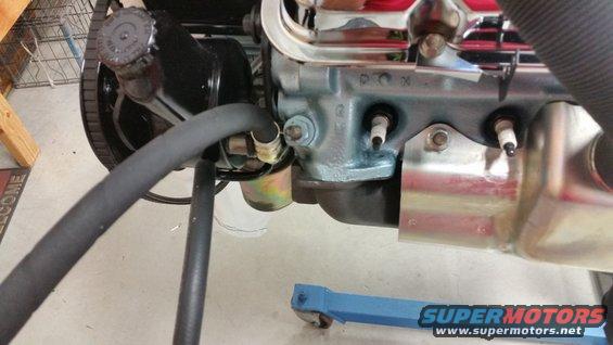 Engine block with spark plugs and hoses, blue paint, chrome accents, SuperMotors logo visible