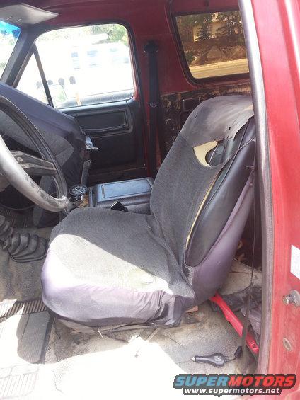 The original seats with covers on them.