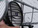 1964 Volkswagen Beetle - Hella off-road driving light with protective grille on a metal rack.