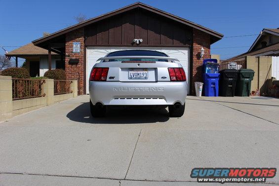 Rear view of a silver 2002 Ford Mustang GT with a license plate reading LVOM193