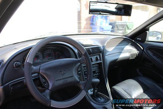2002 Ford Mustang interior with steering wheel and dashboard