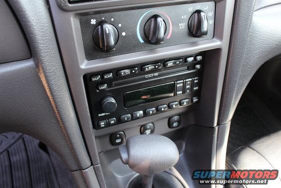 Dashboard of a 2002 Ford Mustang with radio and climate controls