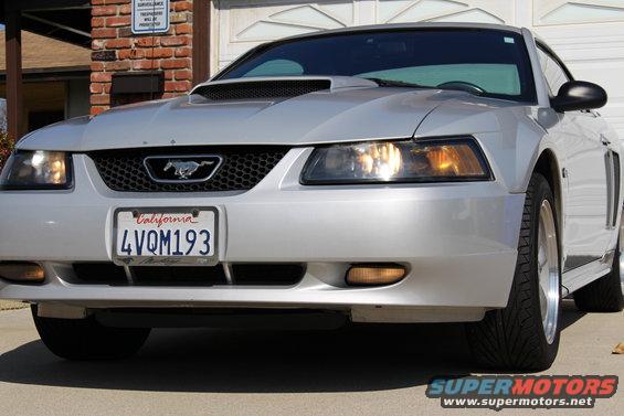 Silver 2002 Ford Mustang front view, California license plate 4VQM193, parked in driveway
