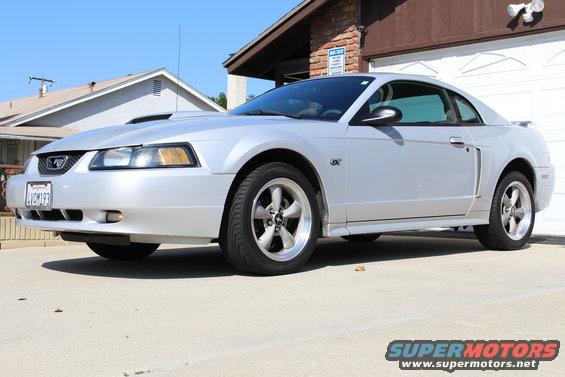 Silver 2002 Ford Mustang coupe parked in driveway