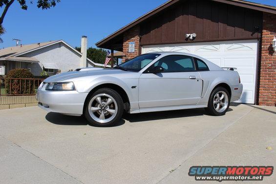 Silver 2002 Ford Mustang GT parked in driveway