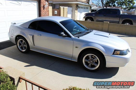 Silver 2002 Ford Mustang GT parked in driveway