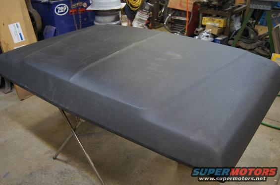 Black hood on a metal stand in a workshop