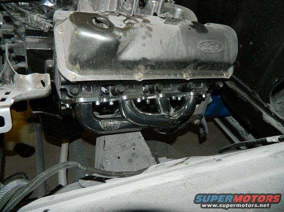 Ford V8 engine block with chrome headers and "Vortec" logo visible
