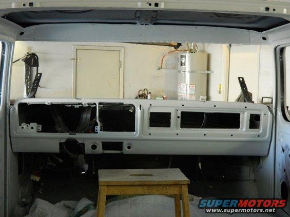 Dashboard of a 1979 Ford Bronco undergoing restoration, showing empty instrument panel and vents