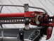 1964 Volkswagen Beetle - Close-up of a red hi-lift jack attached to a vehicle rack, showing its mechanical components.