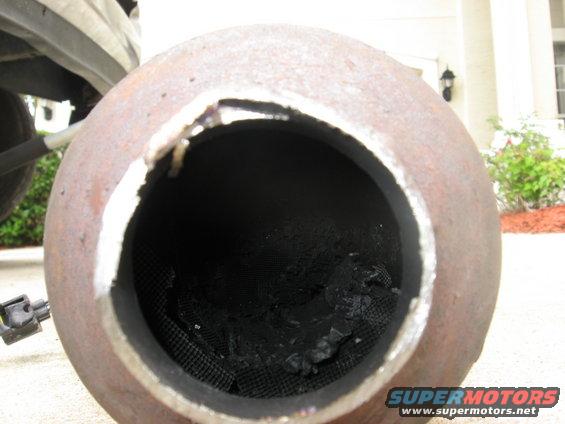 Exhaust pipe with damaged internal honeycomb structure and rust