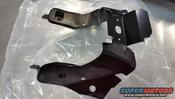 Two black metal automotive parts in plastic packaging. One part has a square connector