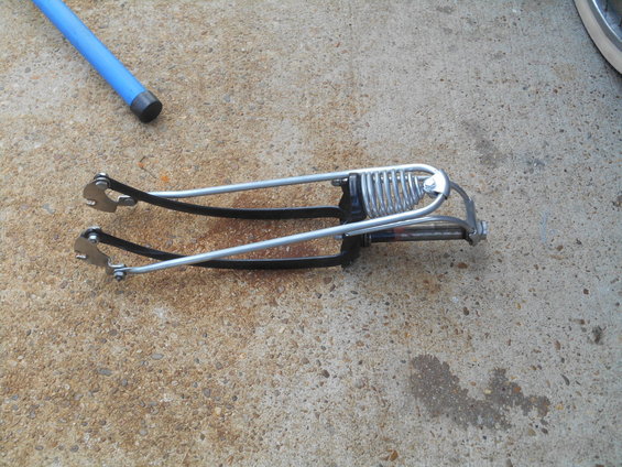 bicycle fork with springs and black straps