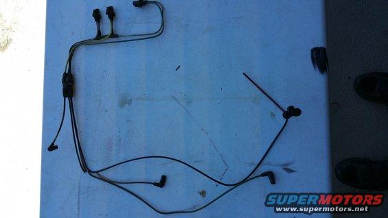 Wiring harness with multiple connectors and black boots