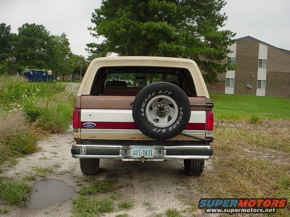 1987 Ford Bronco rear view with spare tire mounted on tailgate. License plate reads ADT-2431