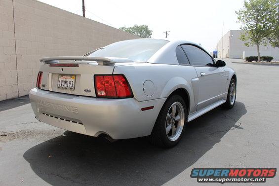 Silver 2002 Ford Mustang coupe, rear 3/4 view, California license plate 4VOM193
