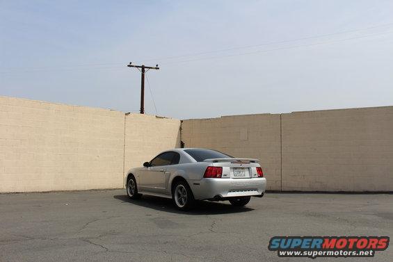 Silver 2002 Ford Mustang coupe, rear view
