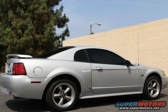 Silver 2002 Ford Mustang coupe parked outdoors, side view