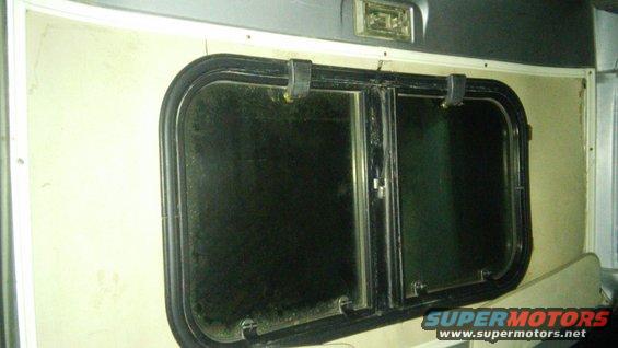 Interior window with black trim and latch