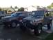 2004 Jeep Grand Cherokee - Two Jeep SUVs, a Wrangler and a Grand Cherokee, are parked side-by-side in a residential driveway.