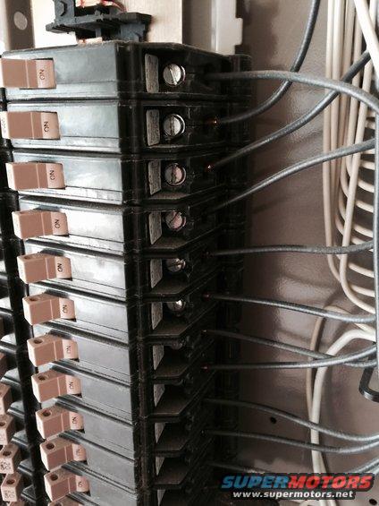 Electrical breaker panel with multiple circuit breakers and wiring