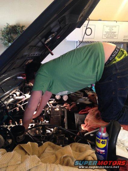 My son, running a tap through all the bolt holes before bolting on the upper plenum.  How about those pickle boxers...