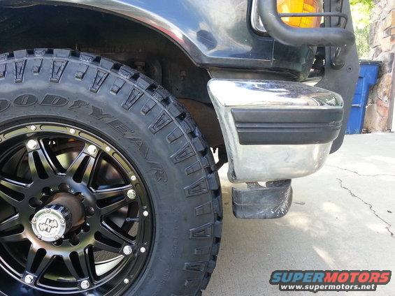 Black 1992 Ford Bronco front wheel and chrome bumper with black trim