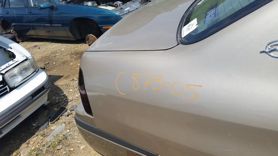 Tan sedan rear quarter panel with orange markings (873-05)