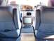 2000 Ford E150 - Interior of a 2000 Ford E150 van, captain's chairs and a built-in television.