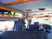 2000 Ford E150 - Interior of a 2000 Ford E150 van with custom wood trim and blue upholstery.