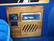 2000 Ford E150 - Close-up of an interior panel a car stereo, video game inputs, and a TV speaker control switch.