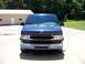 2000 Ford E150 - This blue 2000 Ford E150 van is shown from the front.