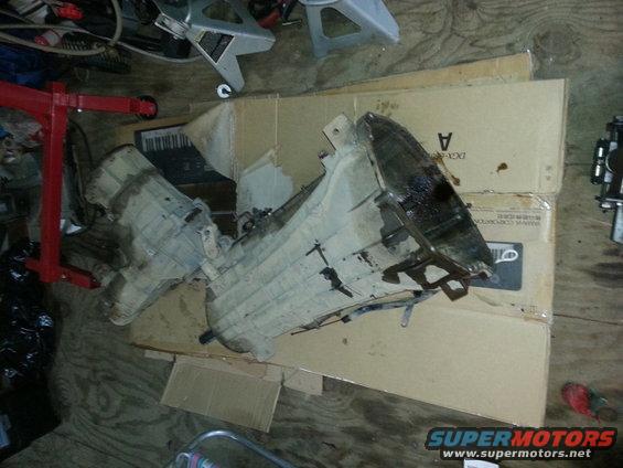 transmission and transfer case components on cardboard boxes