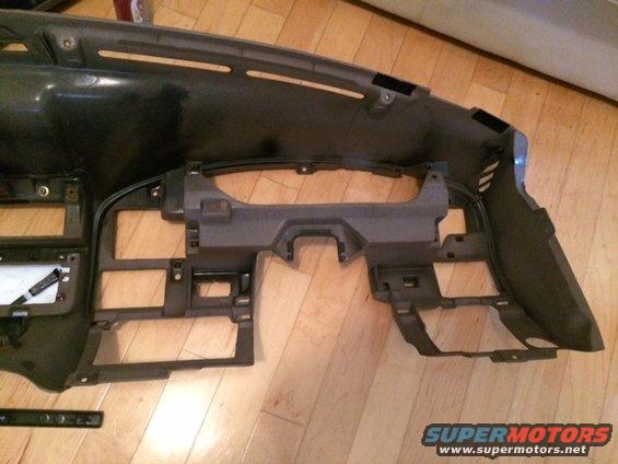 Dashboard frame assembly, looks like it's out of a vehicle. Some wiring is visible