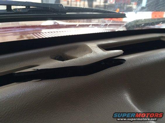 1994 Ford Bronco dashboard showing a cracked plastic trim piece near the windshield